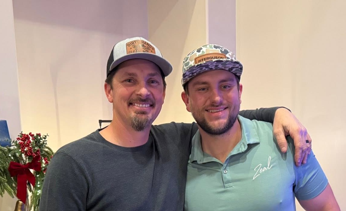 Two members of Legacy Plumbing Group smiling together